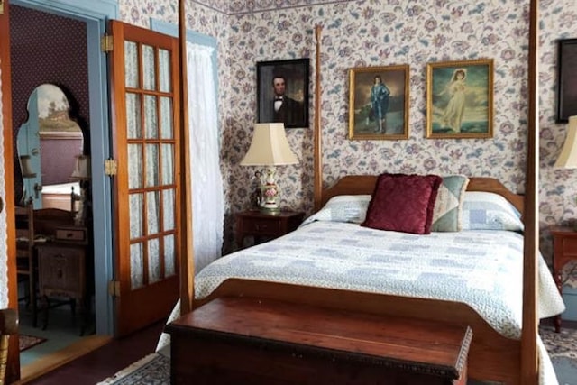 bedroom with wallpapered walls