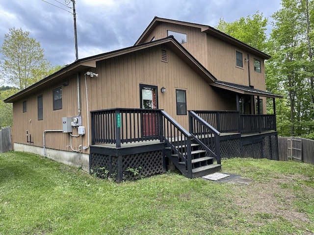 rear view of property featuring a deck