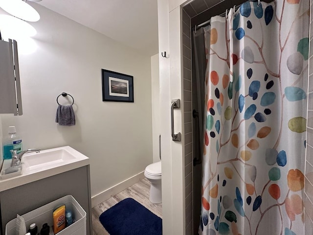 full bath with wood finished floors, vanity, toilet, and a shower with curtain