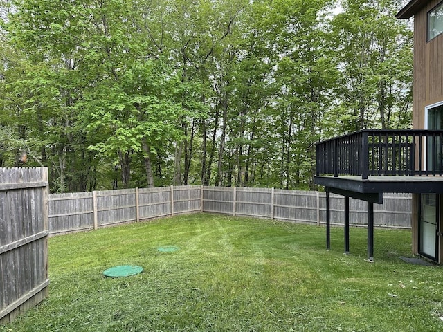 view of yard featuring a wooden deck