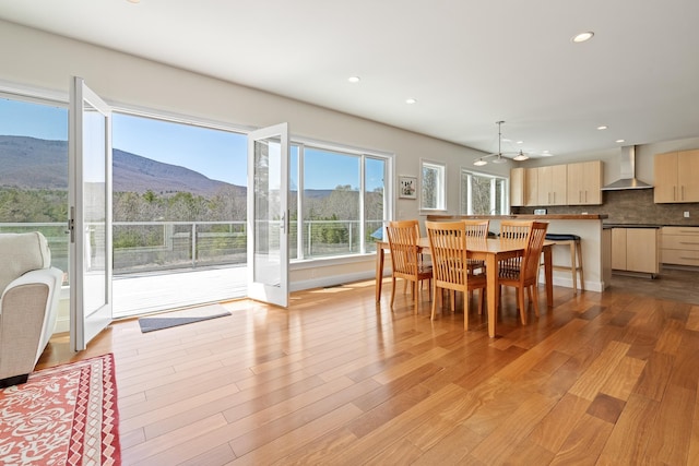7 Timberbrook N, Dorset, VT 05251 - dining area with light wood finished floors, a mountain view, recessed lighting, and a chandelier