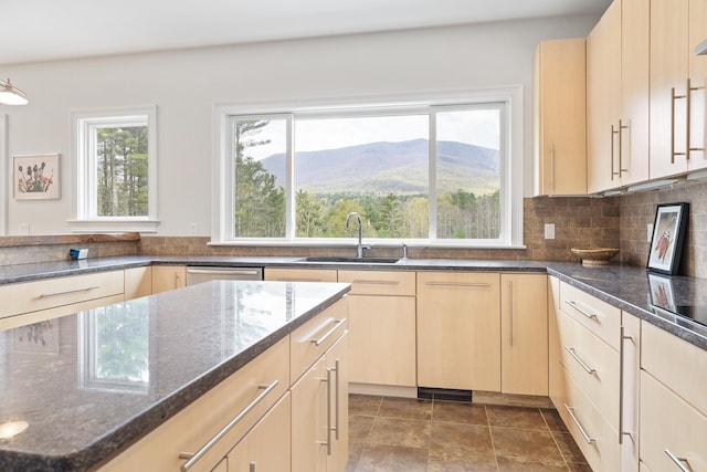 7 Timberbrook N, Dorset, VT 05251 - kitchen with a sink, light brown cabinetry, healthy amount of natural light, and dark stone counters