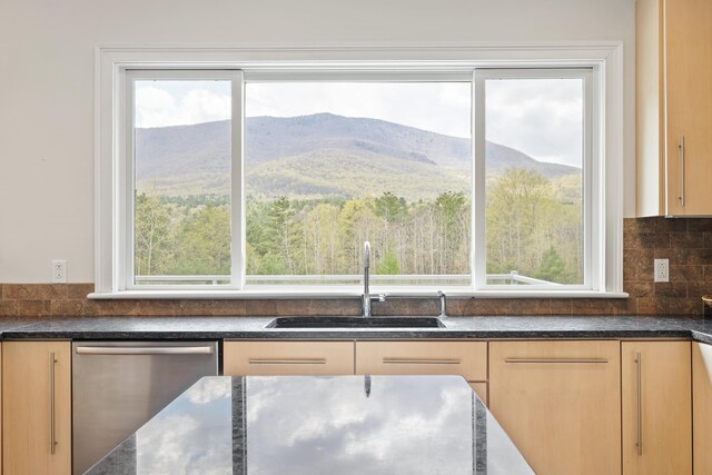 7 Timberbrook N, Dorset, VT 05251 - kitchen featuring a sink, dishwasher, backsplash, and a mountain view