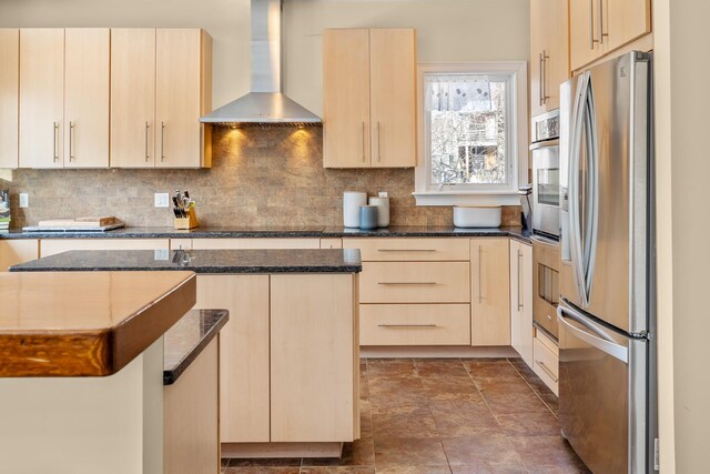7 Timberbrook N, Dorset, VT 05251 - kitchen with freestanding refrigerator, wall chimney exhaust hood, light brown cabinetry, dark stone counters, and decorative backsplash