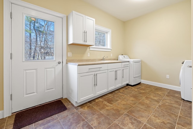 7 Timberbrook N, Dorset, VT 05251 - laundry room with independent washer and dryer, cabinet space, and baseboards