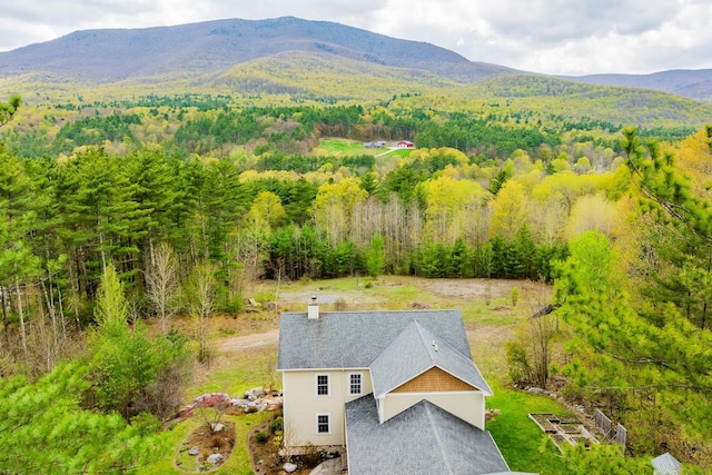7 Timberbrook N, Dorset, VT 05251 - aerial view of property and surrounding area with a heavily wooded area and mountains