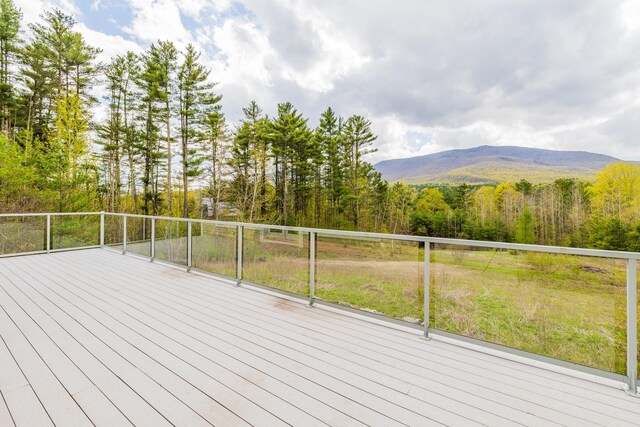 7 Timberbrook N, Dorset, VT 05251 - wooden deck featuring a mountain view and a forest view
