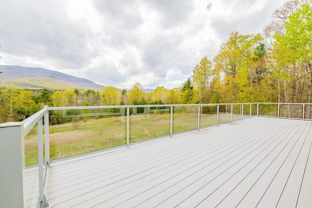 7 Timberbrook N, Dorset, VT 05251 - wooden terrace featuring a forest view, a mountain view, and a yard