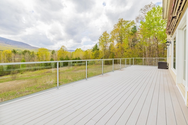7 Timberbrook N, Dorset, VT 05251 - wooden terrace featuring cooling unit, a view of trees, and a yard