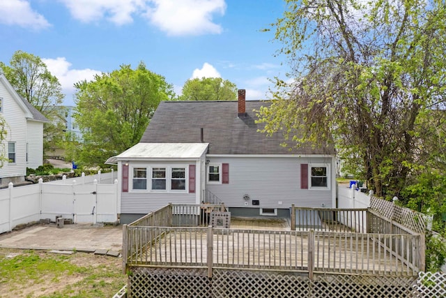 552 Dix St, Manchester, NH 03103 - rear view of property with a deck, a fenced backyard, a chimney, a shingled roof, and a patio area