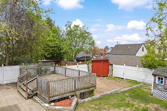 552 Dix St, Manchester, NH 03103 - fenced backyard with a wooden deck and a shed