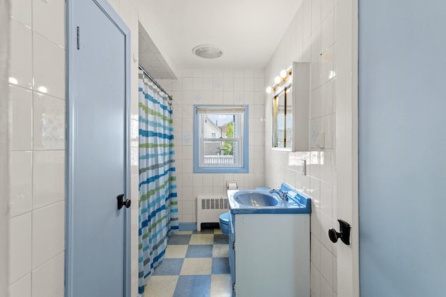552 Dix St, Manchester, NH 03103 - full bathroom with tile walls, radiator, tile patterned floors, vanity, and curtained shower