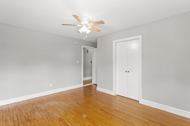 552 Dix St, Manchester, NH 03103 - unfurnished bedroom featuring light wood finished floors, baseboards, a closet, and a ceiling fan