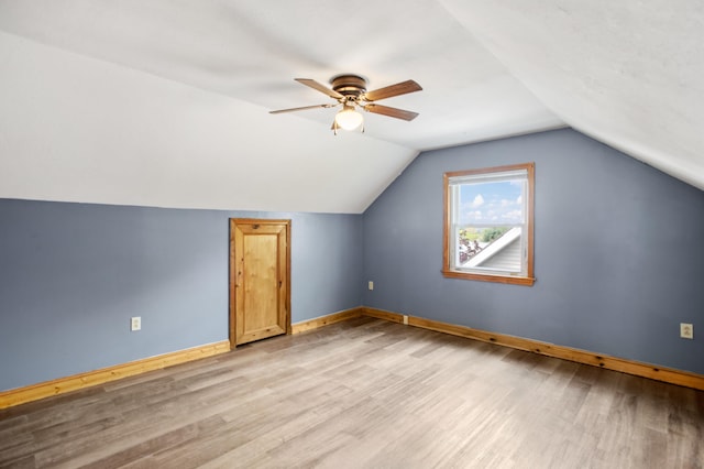552 Dix St, Manchester, NH 03103 - additional living space with light wood finished floors, a ceiling fan, baseboards, and vaulted ceiling