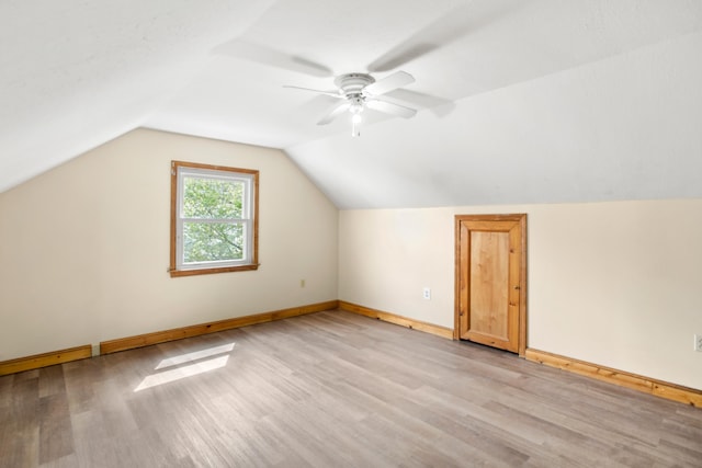 552 Dix St, Manchester, NH 03103 - additional living space with light wood-style flooring, baseboards, lofted ceiling, and ceiling fan