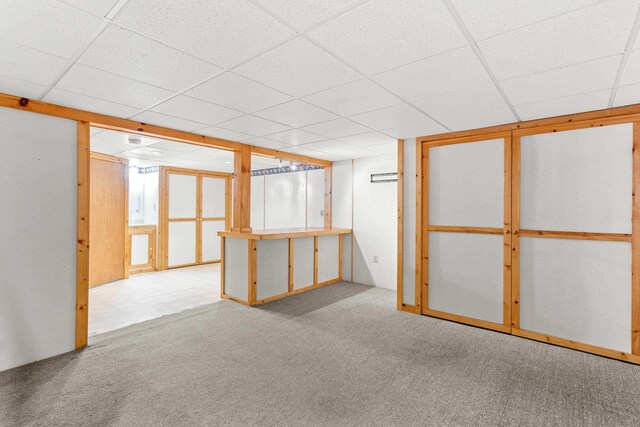 552 Dix St, Manchester, NH 03103 - finished below grade area featuring carpet and a paneled ceiling