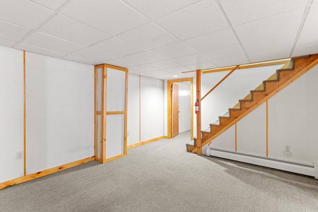 552 Dix St, Manchester, NH 03103 - finished basement featuring carpet flooring, a baseboard heating unit, stairway, a paneled ceiling, and baseboards