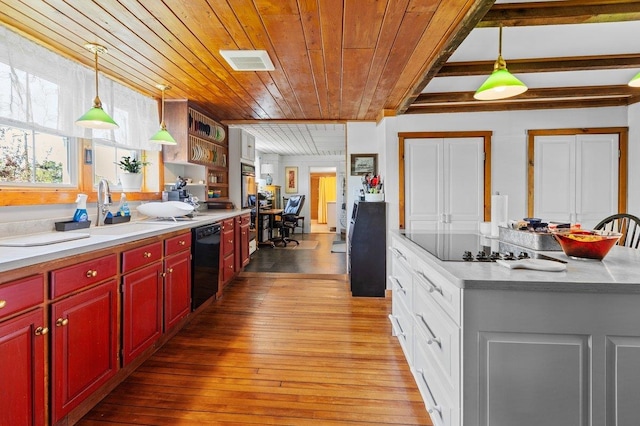 kitchen featuring dishwasher, wood ceiling, a sink, light wood-style floors, and pendant lighting