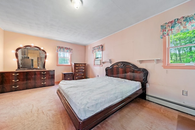 carpeted bedroom with baseboard heating
