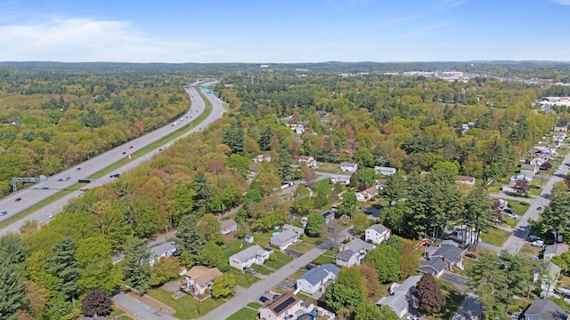 aerial overview of property's location featuring a heavily wooded area