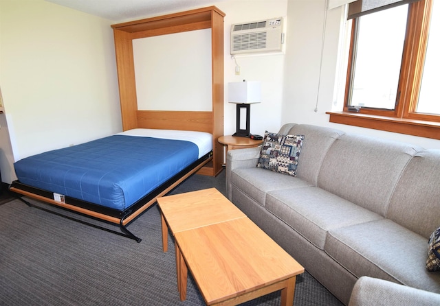 bedroom with carpet flooring and a wall mounted AC