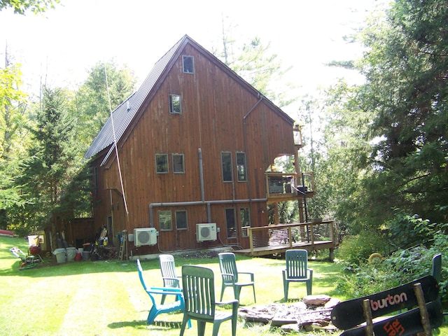 111 Forest Ln, Rochester, VT 05767 - rear view of property with a lawn, a wooden deck, ac unit, a balcony, and metal roof