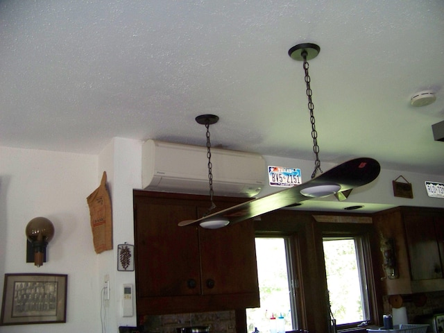 111 Forest Ln, Rochester, VT 05767 - detailed view of an AC wall unit, a smoke detector, and a textured ceiling