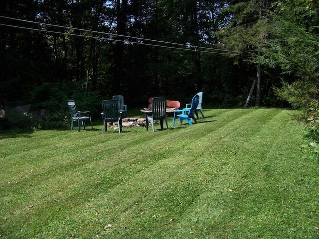 111 Forest Ln, Rochester, VT 05767 - view of grassy yard with an outdoor fire pit