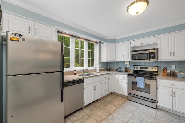 40-21 Harbor Way Unit 21, Wolfeboro, NH 03894 - kitchen featuring stainless steel appliances, white cabinets, light countertops, a sink, and ornamental molding
