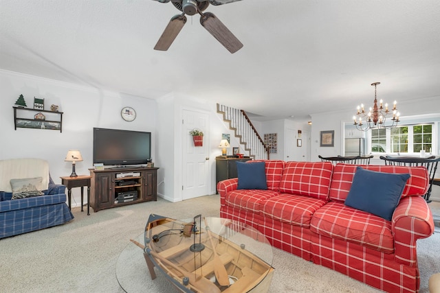40-21 Harbor Way Unit 21, Wolfeboro, NH 03894 - carpeted living room with stairway, crown molding, ceiling fan, a chandelier, and baseboards