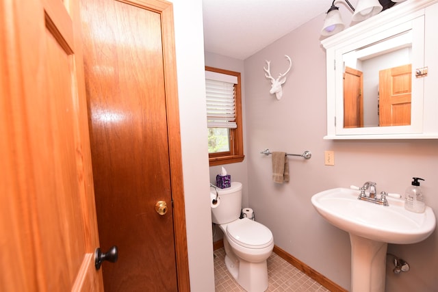 5 Chocorua View Dr, Madison, NH 03849 - half bathroom featuring toilet, baseboards, tile patterned floors, and a sink