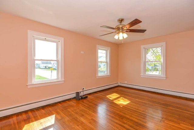 empty room with wood finished floors and ceiling fan