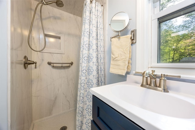 full bath with a shower stall and vanity