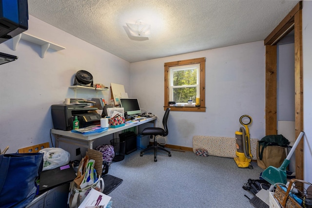 carpeted home office with a textured ceiling