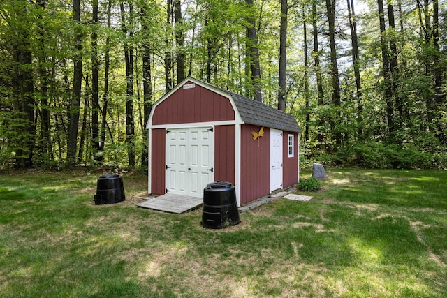 view of shed with a wooded view