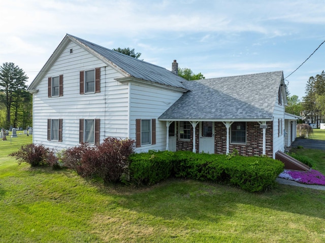 3005 Vt 78 Rte, Highgate, VT 05459 - view of front of home featuring a front lawn, a chimney, and a shingled roof