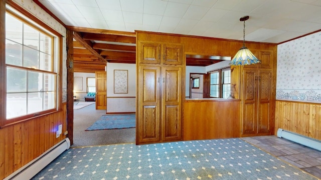 3005 Vt 78 Rte, Highgate, VT 05459 - unfurnished room with a baseboard radiator, wooden walls, wallpapered walls, wainscoting, and carpet