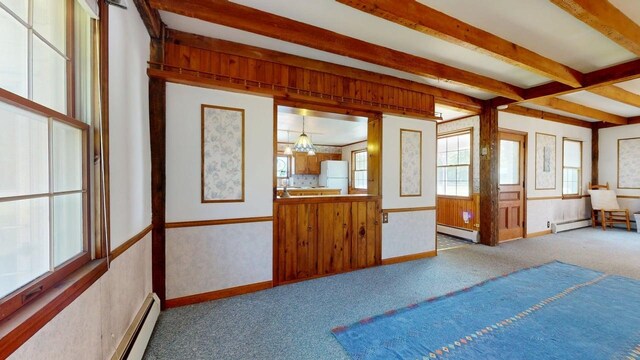 3005 Vt 78 Rte, Highgate, VT 05459 - unfurnished bedroom with freestanding refrigerator, a baseboard radiator, carpet, beam ceiling, and a baseboard heating unit