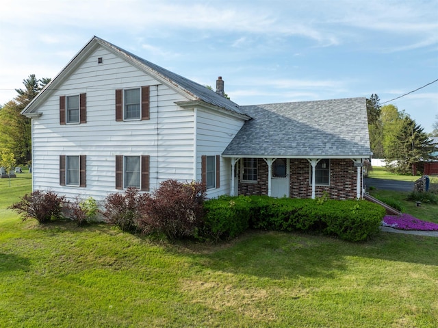 3005 Vt 78 Rte, Highgate, VT 05459 - view of front of home featuring a front yard, a shingled roof, and a chimney