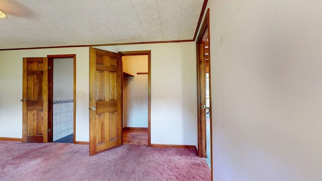 3005 Vt 78 Rte, Highgate, VT 05459 - unfurnished bedroom with carpet floors, baseboards, crown molding, a spacious closet, and a closet
