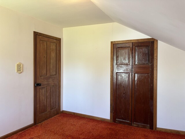 3005 Vt 78 Rte, Highgate, VT 05459 - unfurnished bedroom with lofted ceiling, carpet floors, and baseboards
