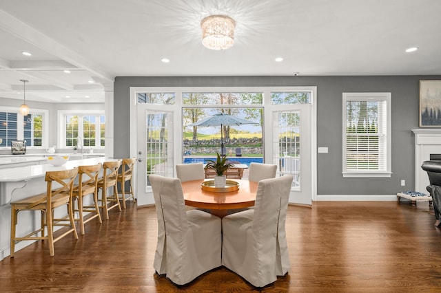 dining room featuring recessed lighting, dark wood-style floors, plenty of natural light, baseboards, and beamed ceiling