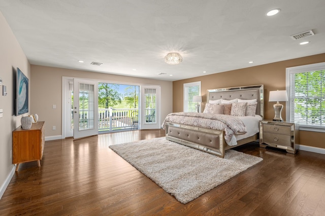 bedroom with access to exterior, baseboards, multiple windows, dark wood-type flooring, and recessed lighting