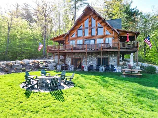 1481 Eaton Rd, Conway, NH 03813 - back of house featuring a fire pit, log siding, a wooden deck, and a yard