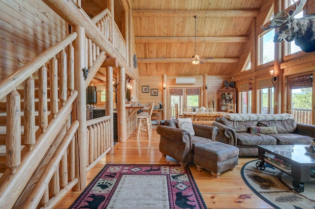 1481 Eaton Rd, Conway, NH 03813 - living room with high vaulted ceiling, a wall unit AC, light wood-style flooring, wooden ceiling, and beam ceiling