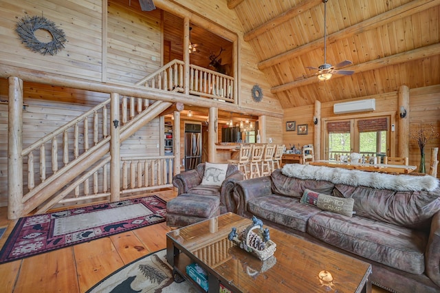 1481 Eaton Rd, Conway, NH 03813 - living room with high vaulted ceiling, a wall mounted air conditioner, wooden ceiling, beamed ceiling, and hardwood / wood-style floors