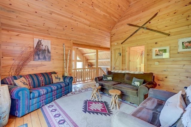 1481 Eaton Rd, Conway, NH 03813 - living area featuring wooden walls, hardwood / wood-style flooring, high vaulted ceiling, and wood ceiling