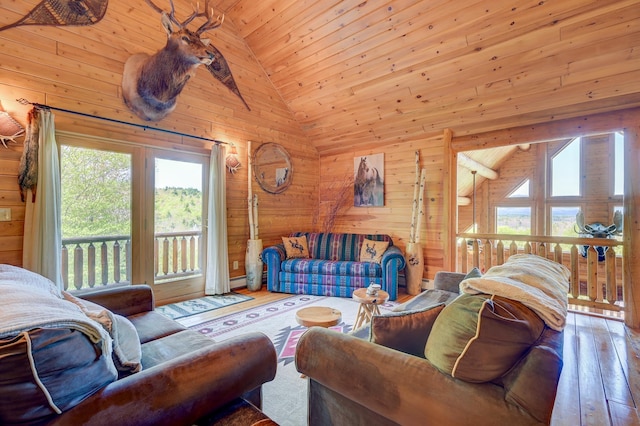 1481 Eaton Rd, Conway, NH 03813 - living area featuring high vaulted ceiling, hardwood / wood-style flooring, wood walls, wooden ceiling, and baseboard heating