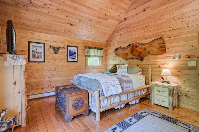 1481 Eaton Rd, Conway, NH 03813 - bedroom featuring wood-type flooring, a baseboard radiator, lofted ceiling, wood ceiling, and wooden walls