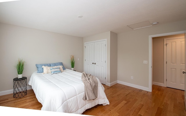 41 Winchester Dr, Hampstead, NH 03826 - bedroom with a closet, light wood-style floors, baseboards, and attic access